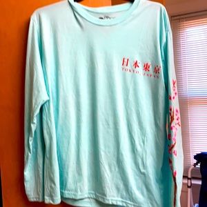 Turquoise Japan graphic long sleeve tee.